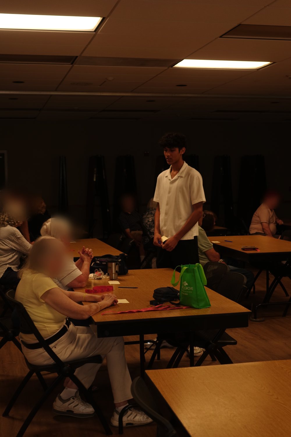 An Unmasked volunteer presenting to a group during an in-person session.